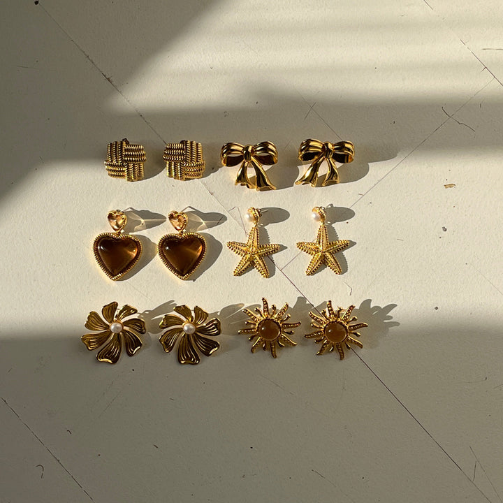 Bold heart shaped earrings with brown stones - 434003B